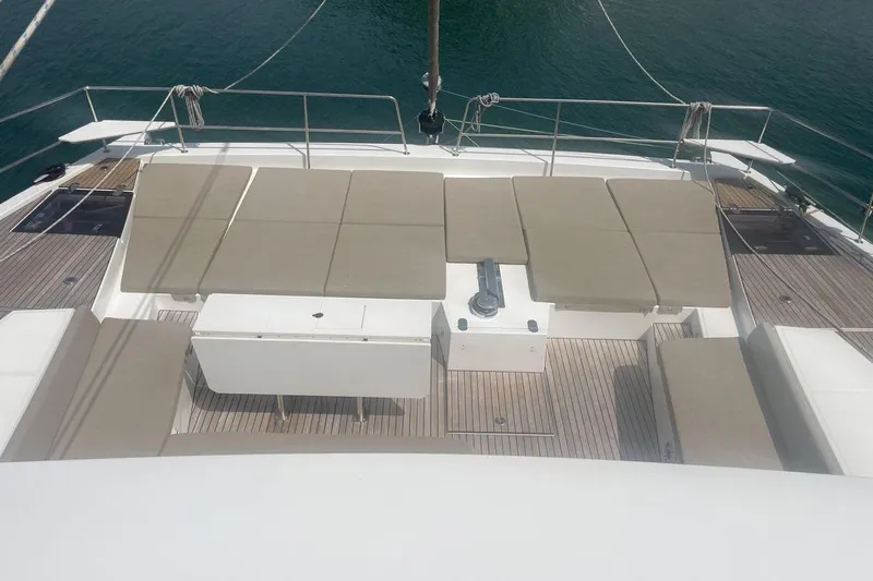 Voyager Yacht Photos Pics Luxurious 2023 Bali 5.4 yacht deck with sun loungers and ocean view.