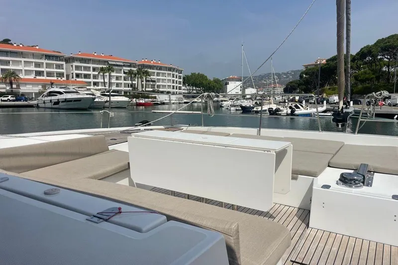 Voyager Yacht Photos Pics Modern Bali 5.4 yacht docked in marina, 2023 model, with luxury seating and scenic waterfront view.