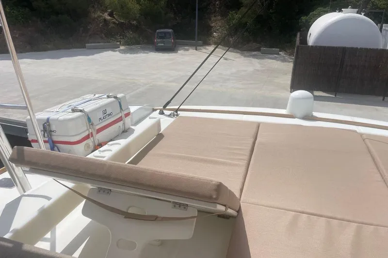 Voyager Yacht Photos Pics 2023 Bali 5.4 yacht deck with sunbathing area and safety equipment.