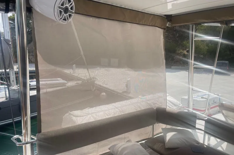 Voyager Yacht Photos Pics 2023 Bali 5.4 yacht interior with sunshade, speaker, and comfortable seating.