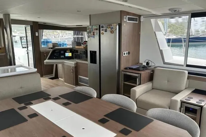 Voyager Yacht Photos Pics Luxurious interior of 2023 Bali 5.4 yacht with modern furnishings and large windows.