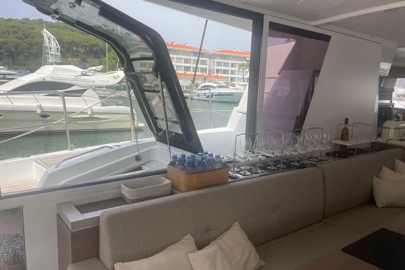 Voyager Yacht Photos Pics Interior of 2023 Bali 5.4 yacht with elegant seating and marina view.