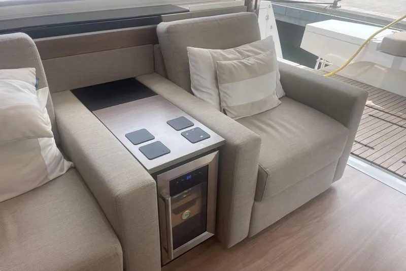 Voyager Yacht Photos Pics Luxurious seating area on 2023 Bali 5.4 yacht with built-in mini fridge.