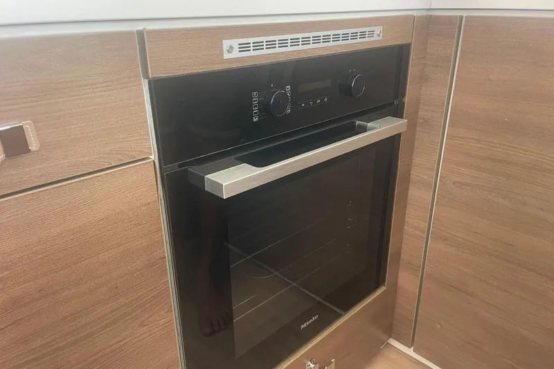 Voyager Yacht Photos Pics Modern kitchen oven with sleek black and stainless steel design, Bali 5.4 model, 2023.