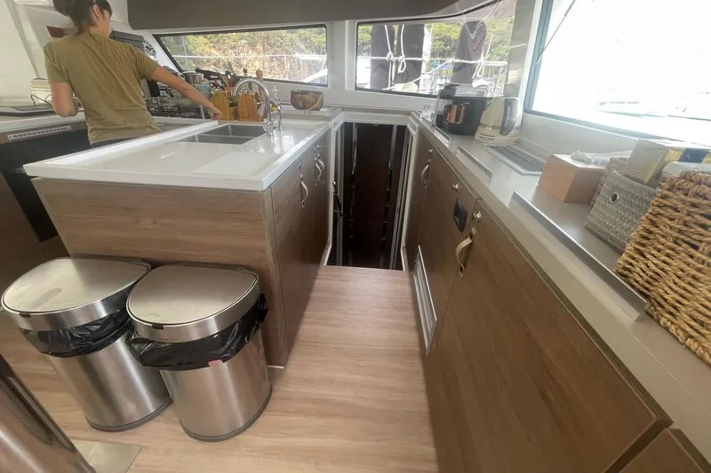 Voyager Yacht Photos Pics Modern kitchen interior on a 2023 Bali 5.4 yacht, featuring sleek countertops and appliances.