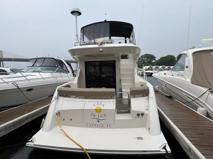 Casa De Luz Yacht Photos Pics 2014 Carver C40 Command Bridge yacht docked at marina, rear view.