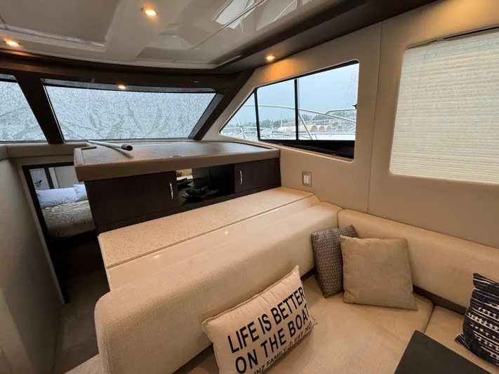 Casa De Luz Yacht Photos Pics Interior of 2014 Carver C40 Command Bridge yacht with cozy seating and decorative pillows.