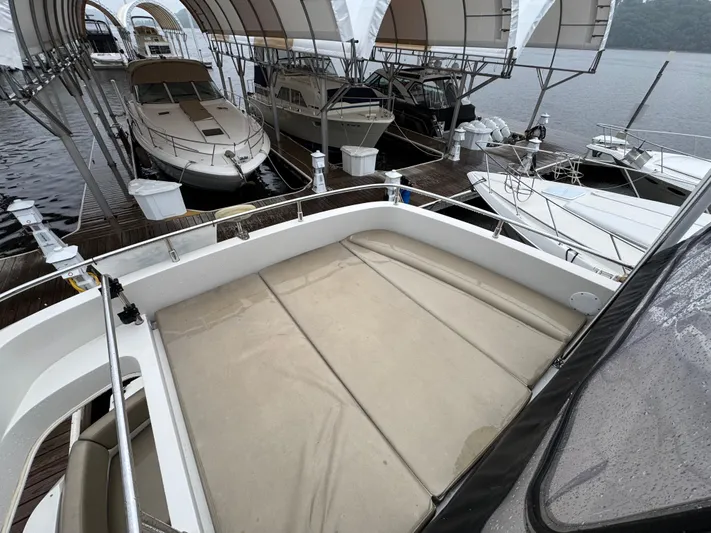 Casa De Luz Yacht Photos Pics 2014 Carver C40 Command Bridge docked among other boats under canopy.