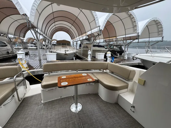 Casa De Luz Yacht Photos Pics 2014 Carver C40 Command Bridge yacht with seating area, docked under covered marina.