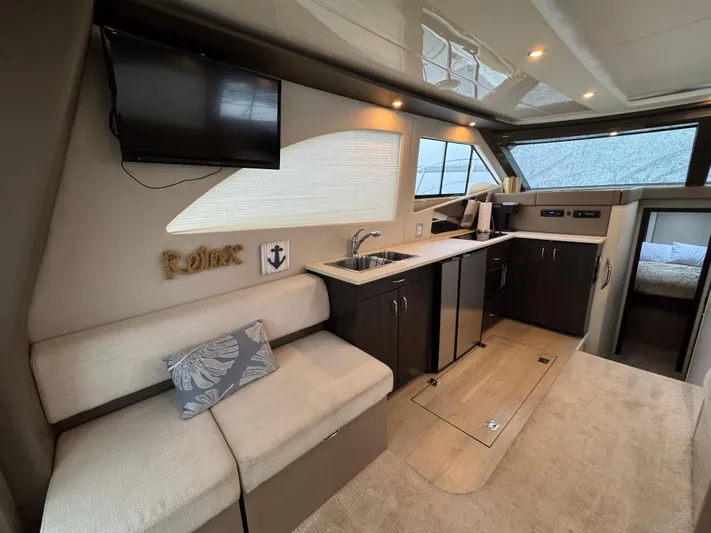 Casa De Luz Yacht Photos Pics 2014 Carver C40 Command Bridge interior with modern kitchen and seating area.
