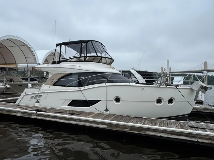Casa De Luz Yacht Photos Pics 2014 Carver C40 Command Bridge yacht docked at marina under cloudy sky.