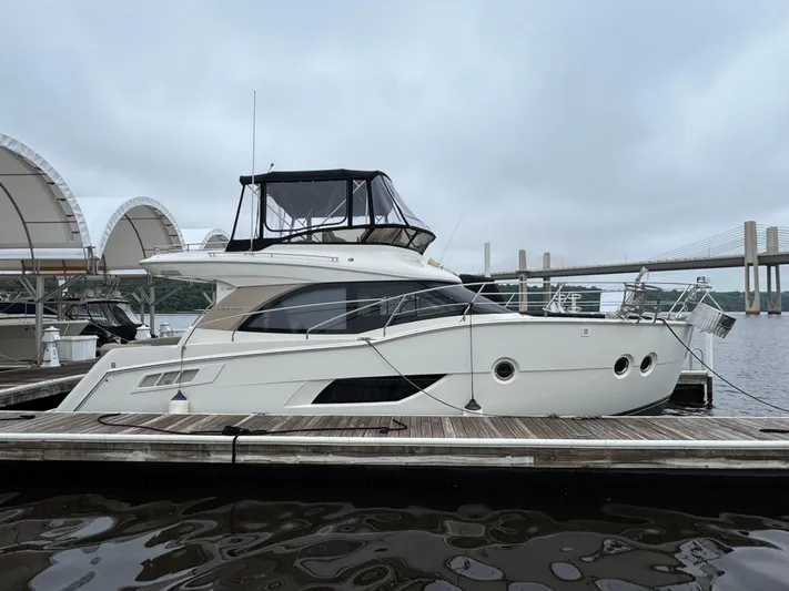 Casa De Luz Yacht Photos Pics 2014 Carver C40 Command Bridge yacht docked at marina with bridge in background.