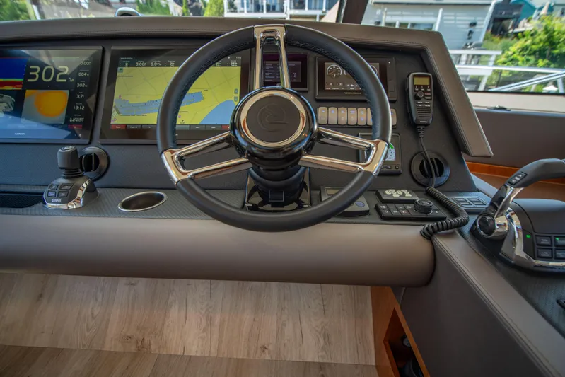  Yacht Photos Pics 2020 Riviera 525 SUV helm with advanced navigation and control systems.