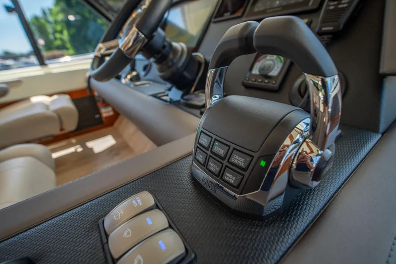  Yacht Photos Pics 2020 Riviera 525 SUV helm with advanced controls and luxurious interior.