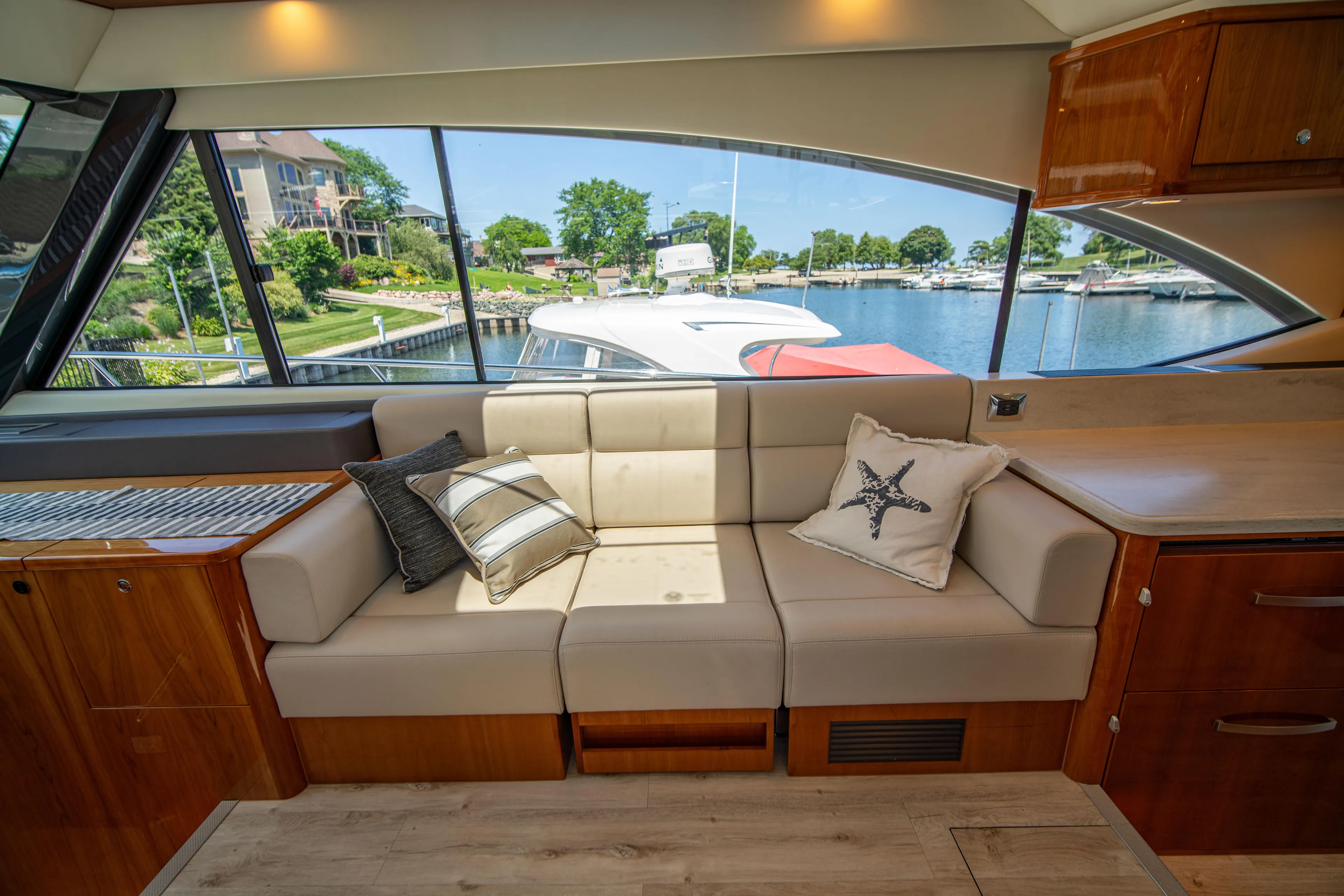  Yacht Photos Pics Luxurious interior of 2020 Riviera 525 SUV yacht with waterfront view.