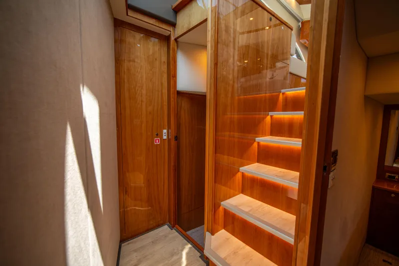  Yacht Photos Pics Interior of 2020 Riviera 525 SUV with wooden stairs and modern design.