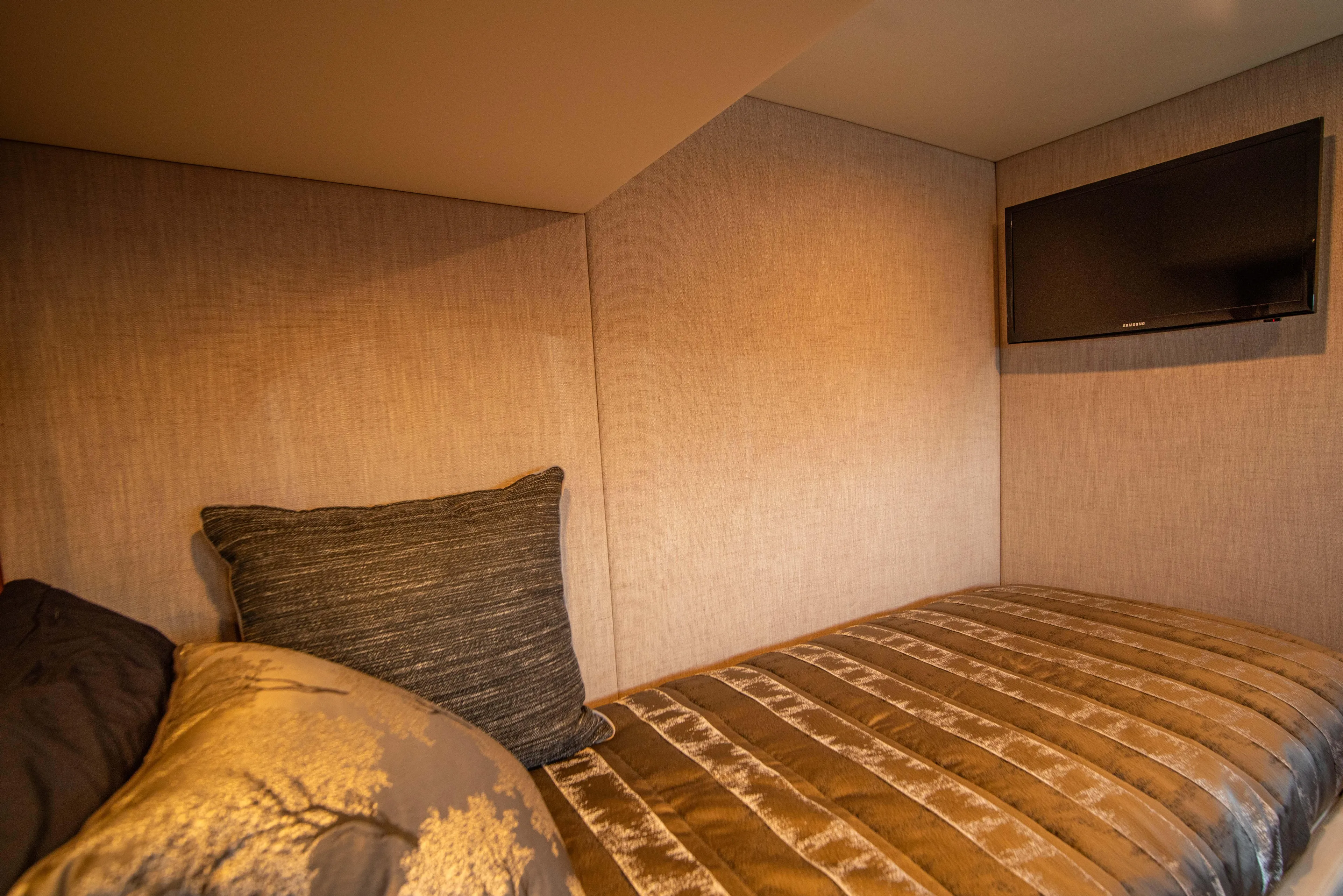  Yacht Photos Pics Cozy interior of 2020 Riviera 525 SUV with bed and wall-mounted TV.