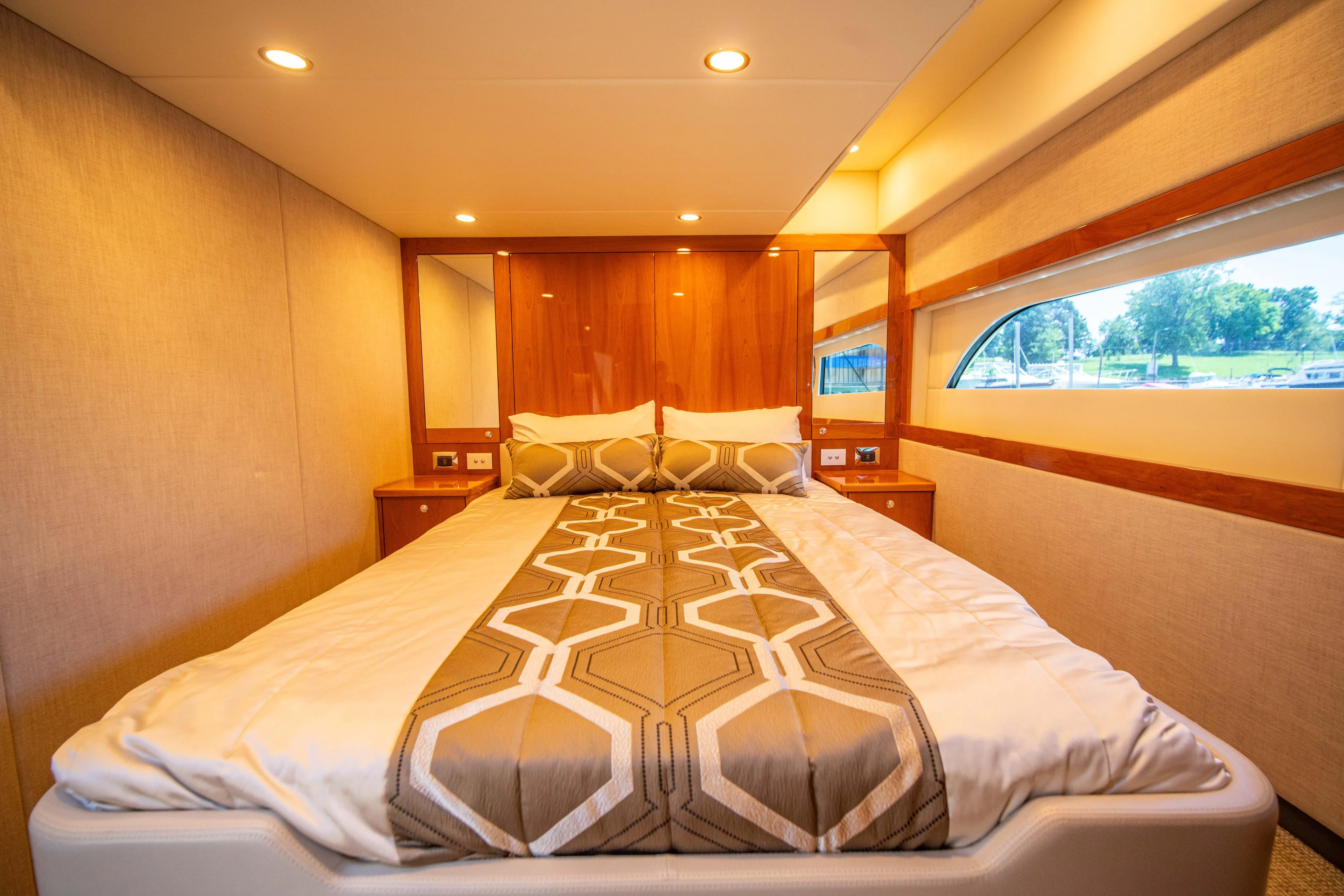  Yacht Photos Pics Luxurious bedroom interior of 2020 Riviera 525 SUV yacht with modern design.