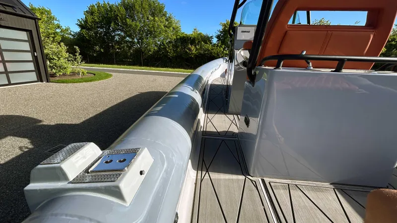  Yacht Photos Pics 2023 Fluid Watercraft M35 boat, sleek design, docked outdoors on a sunny day.