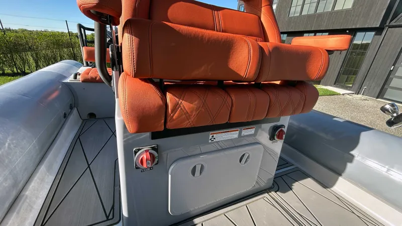  Yacht Photos Pics 2023 Fluid Watercraft M35 boat with orange seating and modern design.