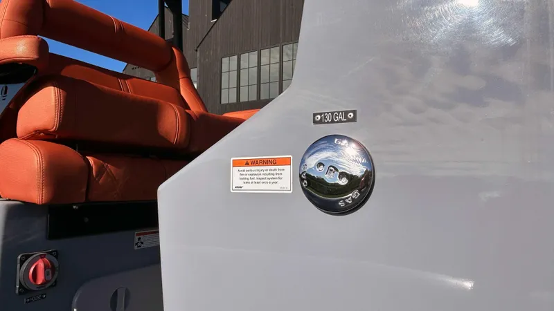  Yacht Photos Pics 2023 Fluid Watercraft M35 boat with orange seats and fuel cap, 130-gallon capacity.