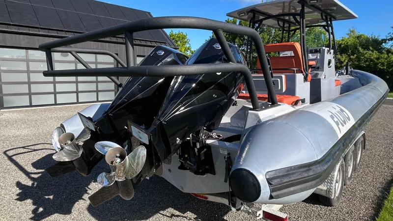  Yacht Photos Pics 2023 Fluid Watercraft M35 boat with dual outboard motors, docked outdoors.