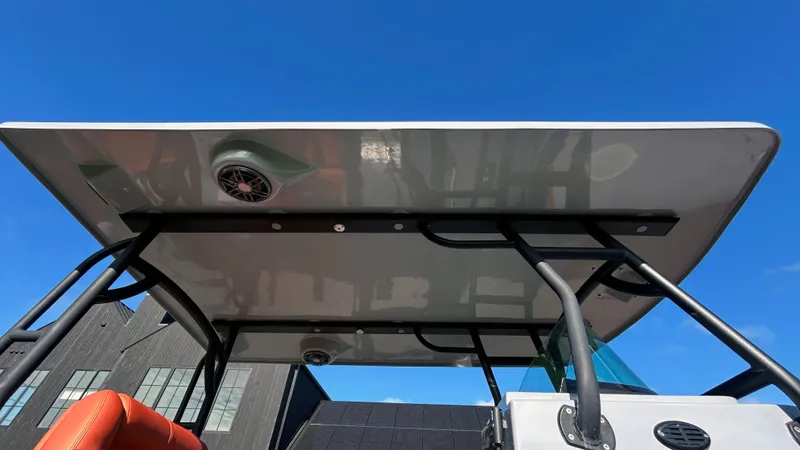  Yacht Photos Pics 2023 Fluid Watercraft M35 boat canopy against clear blue sky.