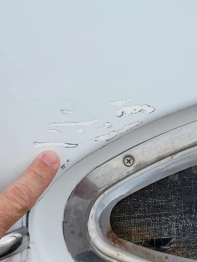 All In Yacht Photos Pics Close-up of paint damage on 2003 Lion Robertson & Caine Lion 46 boat.