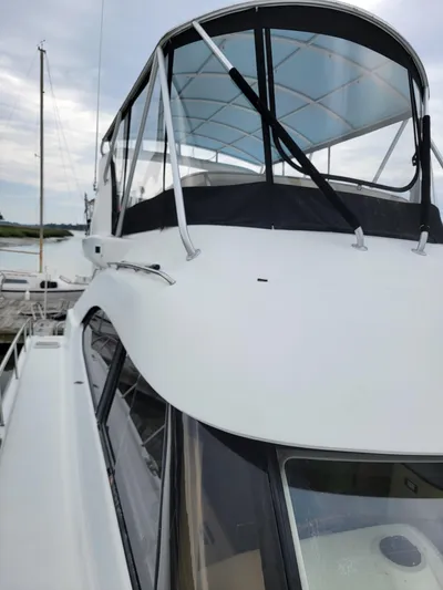 All In Yacht Photos Pics 2003 Lion Robertson & Caine Lion 46 yacht with sleek design and covered cockpit.