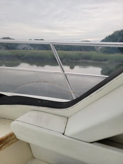 All In Yacht Photos Pics View from 2003 Robertson & Caine Lion 46 boat, overlooking serene river and lush greenery.