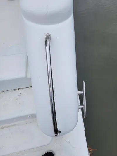 All In Yacht Photos Pics Close-up of a 2003 Robertson & Caine Lion 46 boat railing and cleat.