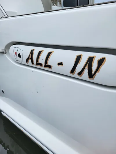 All In Yacht Photos Pics Close-up of "ALL-IN" text on 2003 Robertson & Caine Lion 46 yacht.