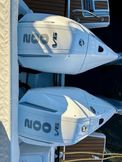 Sea Of Dreams Yacht Photos Pics Twin V6 engines on a 2024 Beneteau Antares 9 boat, docked with wooden deck.