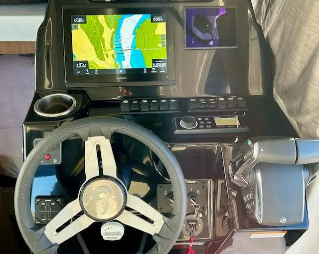 Sea Of Dreams Yacht Photos Pics 2024 Beneteau Antares 9 helm with navigation display and controls.