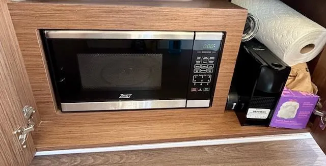 Sea Of Dreams Yacht Photos Pics Microwave and coffee maker in Beneteau Antares 9 yacht kitchen, 2024 model.