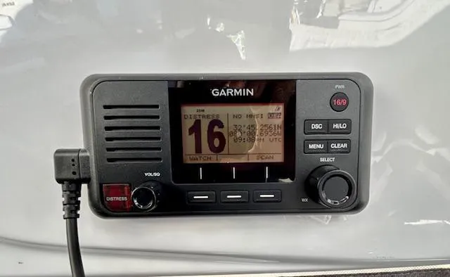 Sea Of Dreams Yacht Photos Pics Garmin marine radio on 2024 Beneteau Antares 9, displaying channel 16 distress signal.