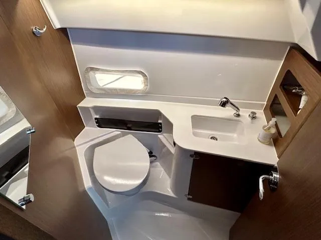 Sea Of Dreams Yacht Photos Pics 2024 Beneteau Antares 9 bathroom with modern fixtures and compact design.