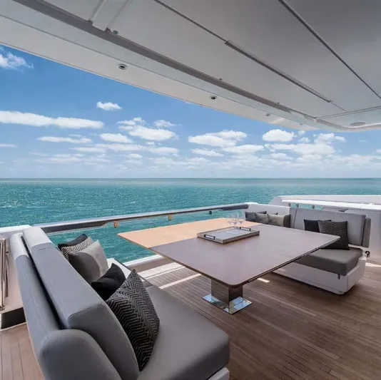  Yacht Photos Pics Luxurious 2025 Ferretti Yachts 860 deck with ocean view and elegant seating.
