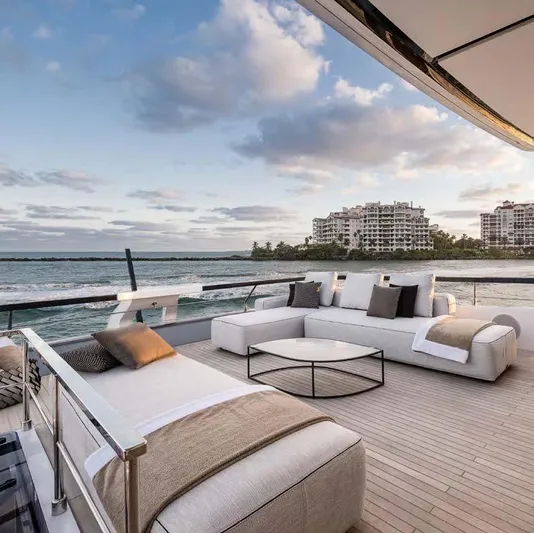  Yacht Photos Pics Luxurious 2025 Ferretti Yachts 860 deck with elegant seating, ocean view, and modern design.