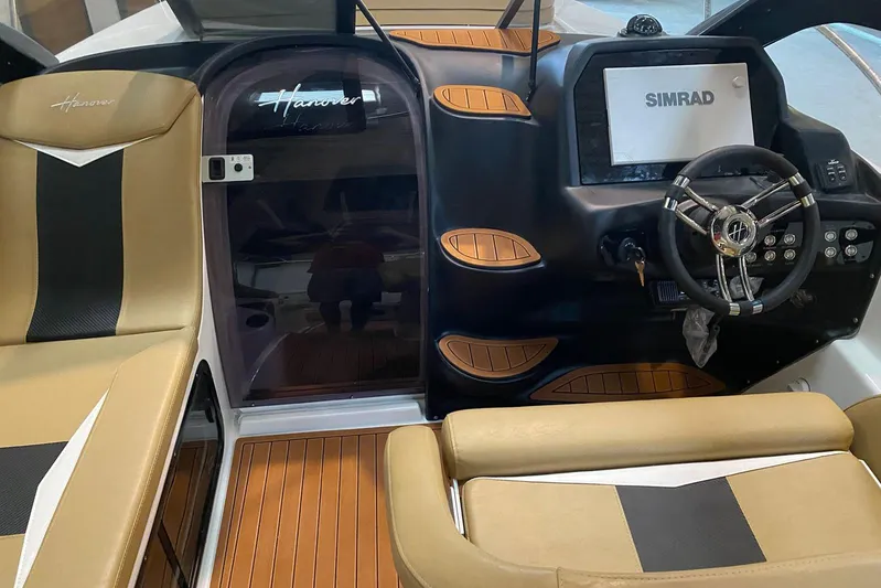  Yacht Photos Pics 2026 Hanover 305 boat interior with Simrad display and stylish seating.
