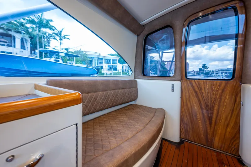 Flying B Yacht Photos Pics 2018 French Yachts Custom Express Sportfish interior with elegant seating and wood accents.