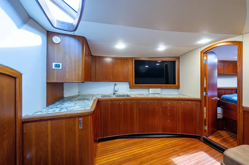 Flying B Yacht Photos Pics Luxurious 2018 French Yachts Custom Express Sportfish interior with wood cabinetry and modern amenities.