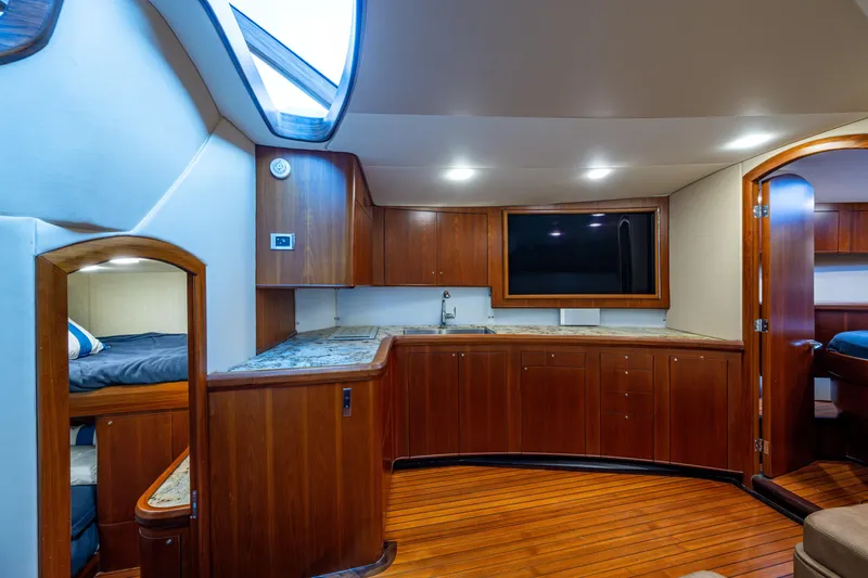 Flying B Yacht Photos Pics Luxurious 2018 French Yachts Custom Express Sportfish interior with wood cabinetry and modern amenities.