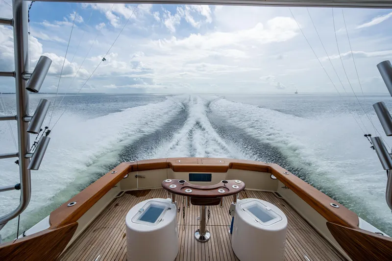 Flying B Yacht Photos Pics 2018 French Yachts Custom Express Sportfish cruising on open water, leaving a wake trail.