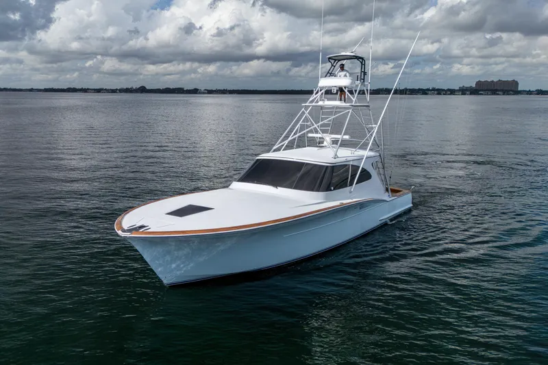 Flying B Yacht Photos Pics 2018 French Yachts Custom Express Sportfish on calm waters under cloudy sky.