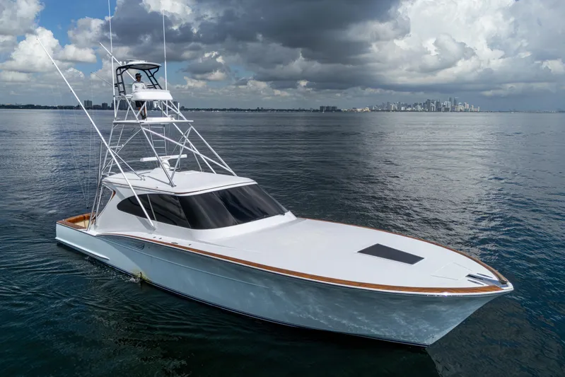 Flying B Yacht Photos Pics 2018 French Yachts Custom Express Sportfish on calm waters under cloudy skies.