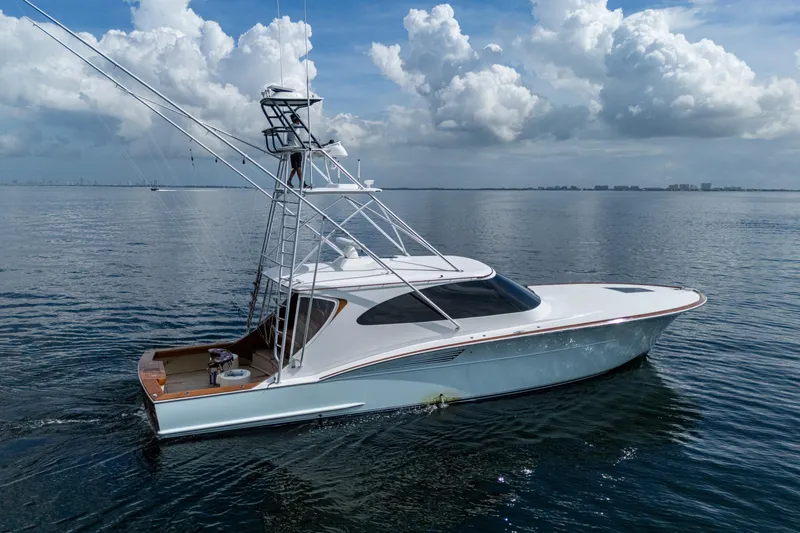 Flying B Yacht Photos Pics 2018 French Yachts Custom Express Sportfish on calm ocean waters under cloudy sky.