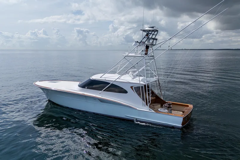 Flying B Yacht Photos Pics 2018 French Yachts Custom Express Sportfish on calm ocean waters under cloudy sky.