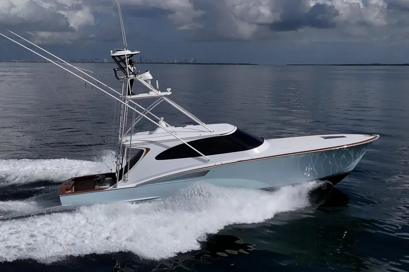 Flying B Yacht Photos Pics 2018 French Yachts Custom Express Sportfish cruising on calm ocean waters.