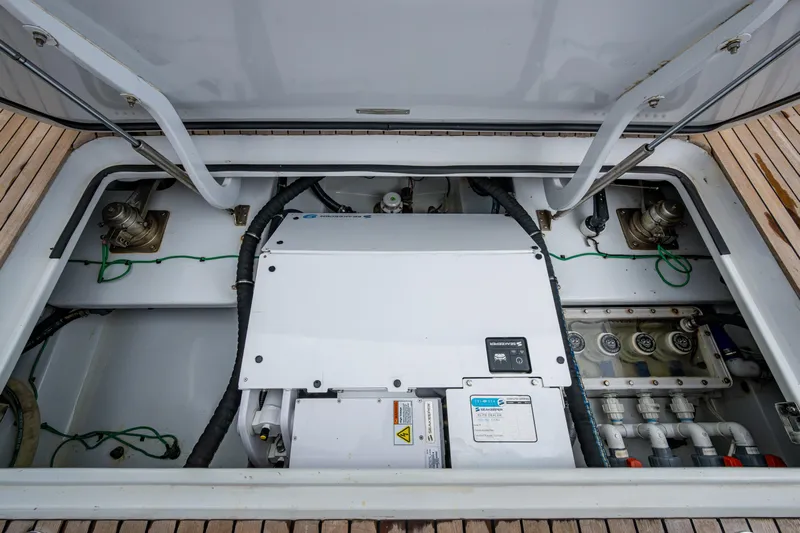 Flying B Yacht Photos Pics Engine compartment of 2018 French Yachts Custom Express Sportfish, showcasing mechanical components.